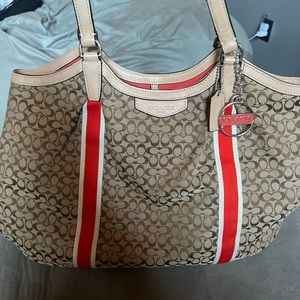Coach signature purse trimmed in orange